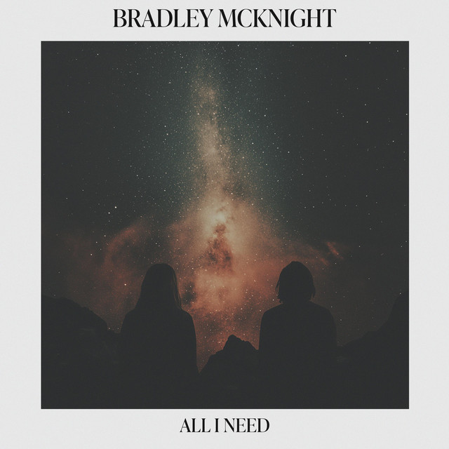 Single artwork for All I Need: two people in silhouette sit side by side under a starry night sky and the Milky Way.